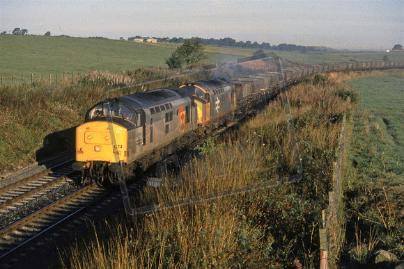 11-27 37674 & 37672 (Cat No 11-27) Approaching Knockinch branch. Empty HAAs. 12-09-90 Ian Ball
