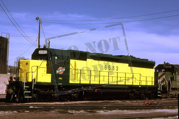 6583 CNW SD45 EX BURLINGTON NORTHERN SD45. COUNCIL BLUFFS 30TH APRIL 1986 PAUL F DeLUCA