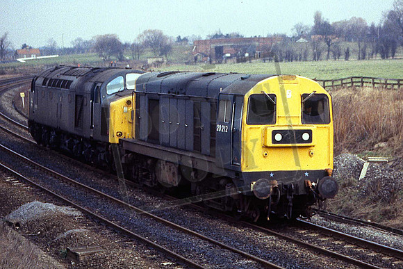20212 & 40153 (Cat No UN20212) Chaloners Whin Junction. 12-02-1982. 40 being hauled to Stratford for stripping.